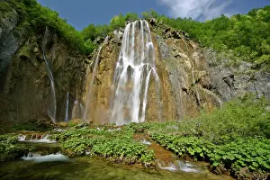 Cascading: Waterfall cascading down steep cliffs in lower canyon area
