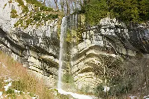 Folded: Waterfall over folded Jurassic limestone strata