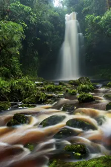 Cueva: waterfall Lindosa, rainforest stream with brown