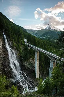 Viaduct: Waterfall with rail viaduct bridge Matterhorn Mountain