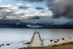 Piers: Waterfront Pier with woman standing on the edge