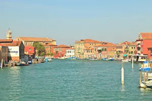 Canal: Waterfront view of colorful pastel buildings