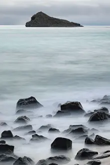 Waves: Waves crashing over lava rocks on shoreline of Espanola