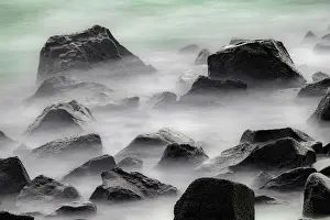 Waves: Waves crashing over lava rocks on shoreline of Espanola