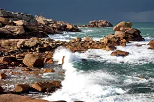 Crashing: Waves crashing against rocky coastline