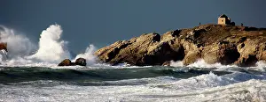 Crashing: Waves crashing against rocky coastline