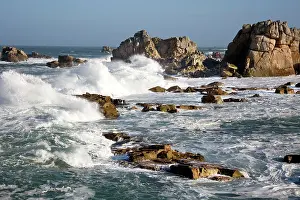 Crashing: Waves crashing against rocky coastline