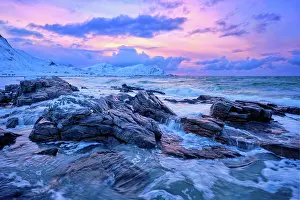 Flakstady: Waves of Norwegian sea on rocky coast in fjord o