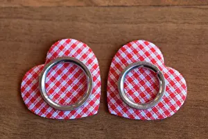 Rings: Wedding rings lying on two red and white checkered