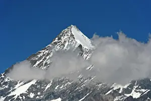 Pyramid: Weisshorn summit with snow and clouds, Valais Alps