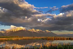Montana: Wetlands pond reflects the Mission Mountains at sunset at