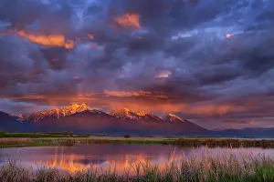 Montana: Wetlands pond reflects the Mission Mountains at sunset at