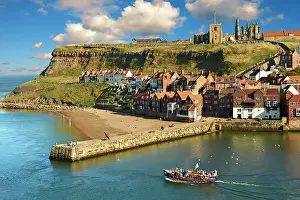 Headland: Whitby harbour with Whitby Abbey on the headland