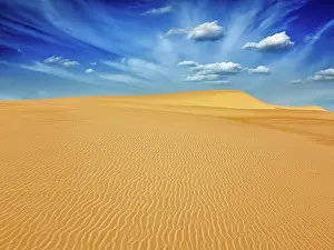 Daybreak: White sand dunes in desert on sunrise, Mui Ne, Vietnam, Asia
