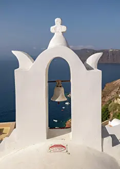 Christianity: Whitewashed bell-tower wiith a view of caldera a