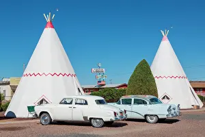 Automobile: Wigwam Motel, tepees with two vintage cars, Route