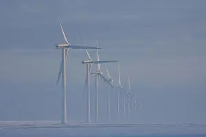 Generator: Wind Turbine generating power on a wind farm