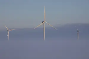 Generator: Wind Turbine generating power on a wind farm