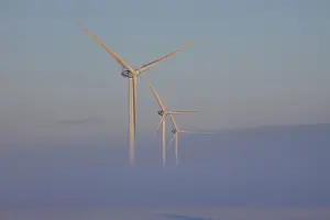 Generator: Wind Turbine generating power on a wind farm