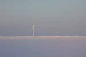 Generator: Wind Turbine generating power on a wind farm