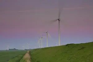 Generator: Wind Turbine generating power on a wind farm