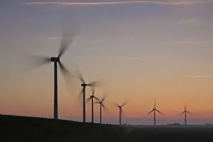 Generator: Wind Turbine generating power on a wind farm