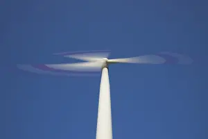 Generator: Wind Turbine generating power on a wind farm