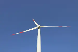 Generator: Wind Turbine generating power on a wind farm