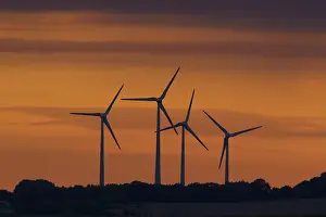 Generator: Wind Turbine generating power on a wind farm