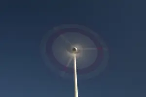 Generator: Wind Turbine generating power on a wind farm