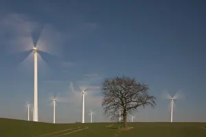 Generator: Wind Turbine generating power on a wind farm