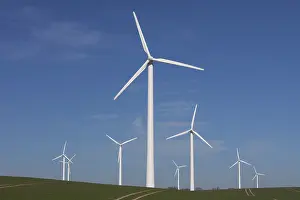Generator: Wind Turbine generating power on a wind farm