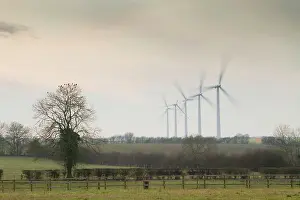 Producing: Wind Turbine - A row of wind turbines producing green energy