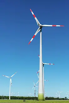 Cost: Wind turbines against a blue sky in Germany