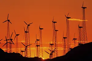 Generating: Wind turbines generating electricity at a windmill farm