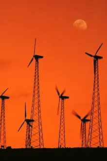 Generating: Wind turbines - at sunset, generating electricity