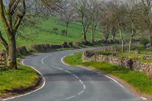 Flanked: Winding road - winding road flanked by typical stone