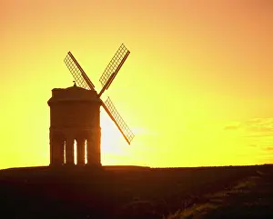 Warwickshire: Windmill - built on stone arches - silhouette at sunset
