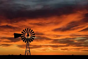 Valdes: Windmill on the Patagonian steppe at sunset, on