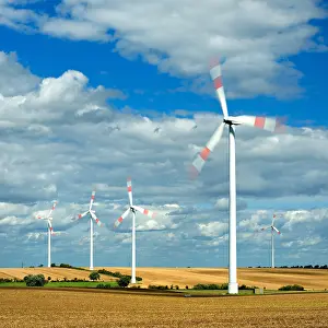 Harvested: Windmills turning, cloudy stormy sky, harvested