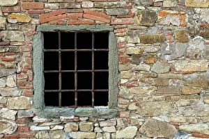 Bars: Window with metal bars on ancient stone