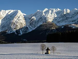Styria: Winter landscape, chapel in front of Grimming mountain