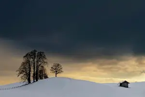 Allgau: Winter landscape against a dramatic sky, Obergunzburg