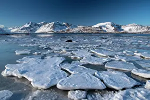 Floes: Winter Scandinavian landscape, ice floes, mountains
