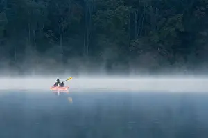 Canoes: Woman and Dog canoeing