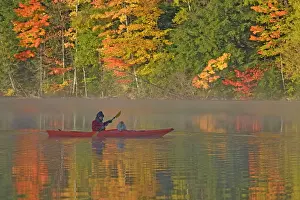 Canoes: Woman and Dog canoeing