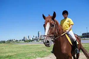 Saddle: Woman exercising at the jump center of equitherapy