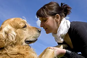 Giving: Woman and Golden Retriever France