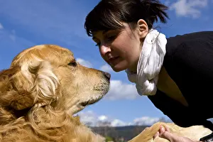 Giving: Woman and Golden Retriever France