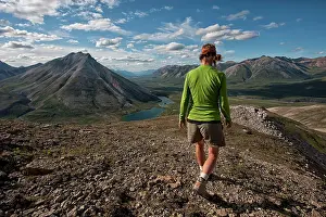 Hikers: Woman Hiker / Walker hiking in wilderness mountains